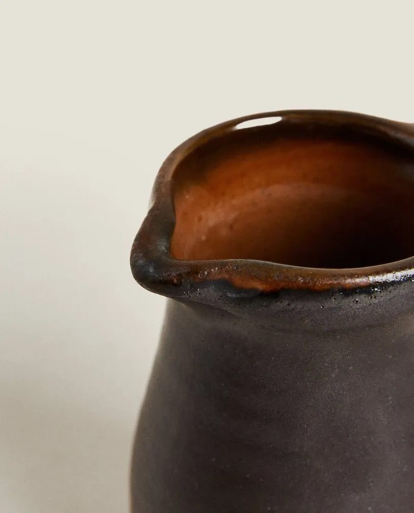 STONEWARE JUG WITH HANDLE