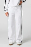 Pantalon d'entraînement en molleton avec rayures latérales