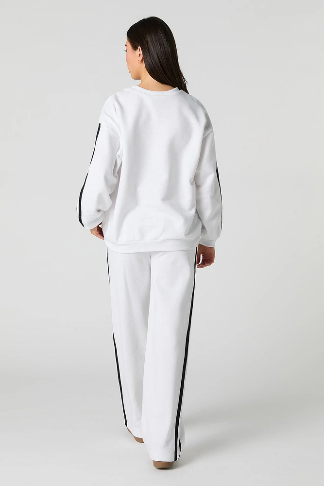 Pantalon d'entraînement en molleton avec rayures latérales