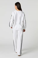 Pantalon d'entraînement en molleton avec rayures latérales