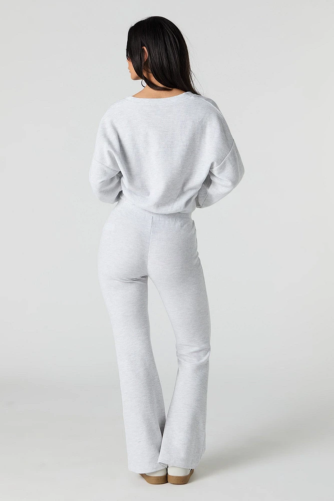 Pantalon en molleton tricot gaufré à jambe évasée