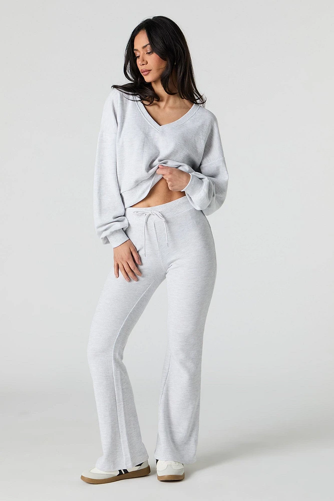 Pantalon en molleton tricot gaufré à jambe évasée