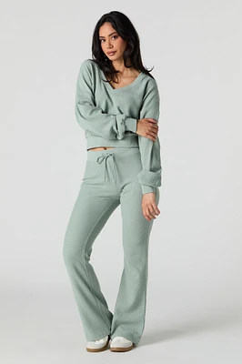 Pantalon en molleton tricot gaufré à jambe évasée