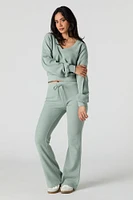 Pantalon en molleton tricot gaufré à jambe évasée