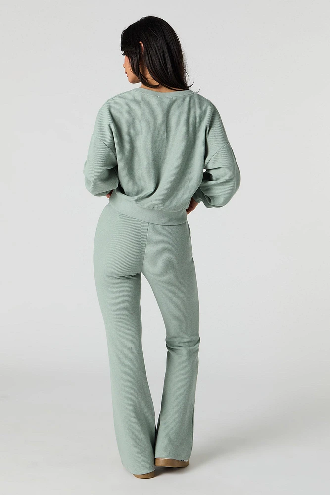 Pantalon en molleton tricot gaufré à jambe évasée