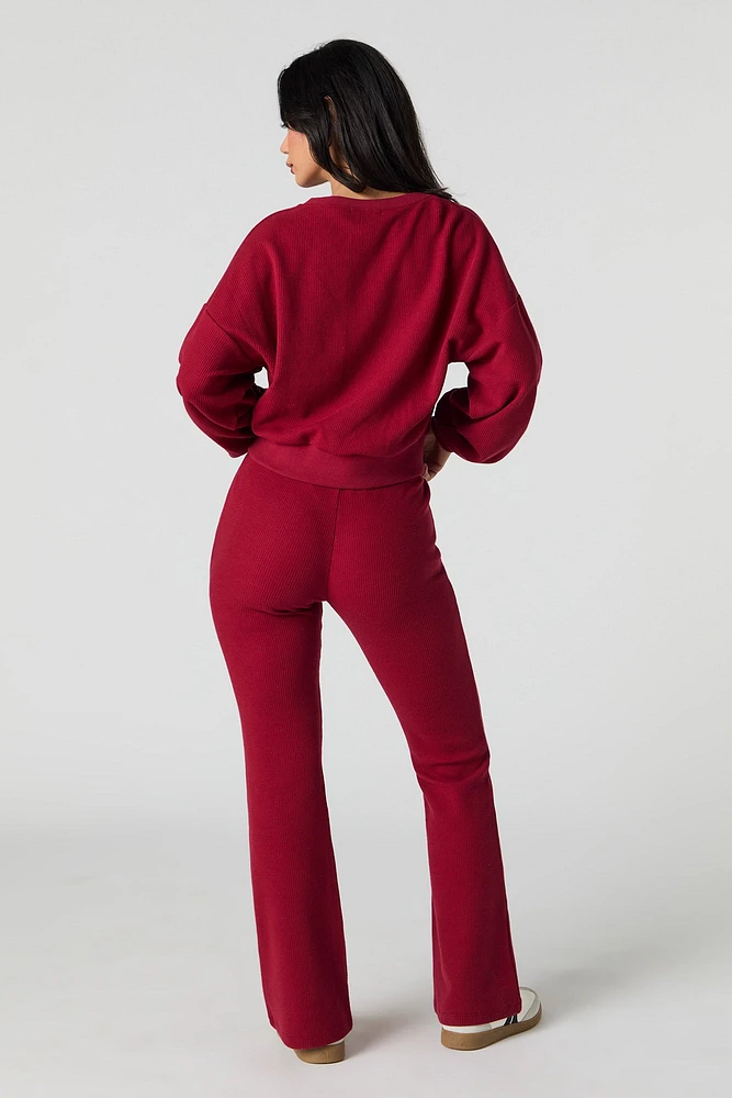 Pantalon en molleton tricot gaufré à jambe évasée
