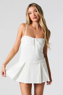 Combi-short plissé avec attache et ourlet de dentelle
