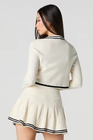 Jupe-short de tennis plissée avec liséré en tricot rayé