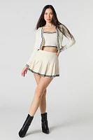 Jupe-short de tennis plissée avec liséré en tricot rayé