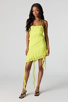 Minirobe asymétrique volantée en filet