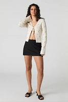 Cardigan en tricot côtelé fleuri avec motif brodé et attache avant