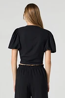 Haut court avec manches bouffantes et attache