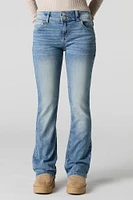 Jean mi-taille à jambe évasée et double boutonnage