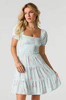 Minirobe volantée fleurie avec manches bouffantes