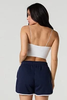 Short en molleton avec motif brodé et ourlet arrondi