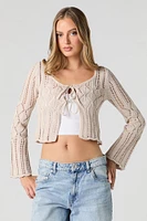 Chandail asymétrique en tricot ajouré avec attache