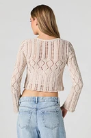 Chandail asymétrique en tricot ajouré avec attache