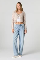 Chandail asymétrique en tricot ajouré avec attache