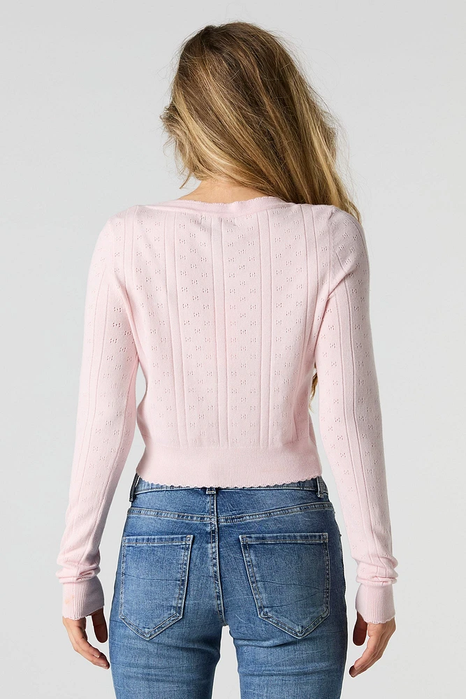 Cardigan écourté en tricot pointelle boutonn
