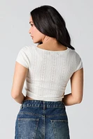 T-shirt écourté en tricot pointelle à bordure dentelle