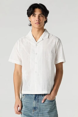 Haut boutonné avec motif de feuille brodé et oeillets