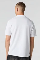 Polo rayé à motif géométrique