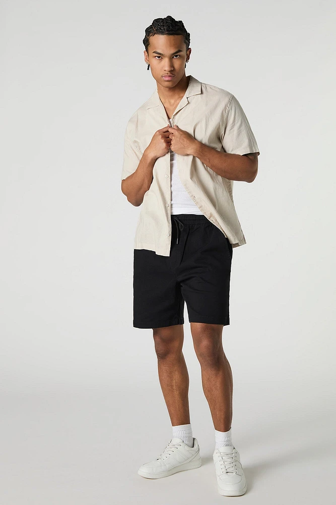 Short mi-long uni à taille coulissante