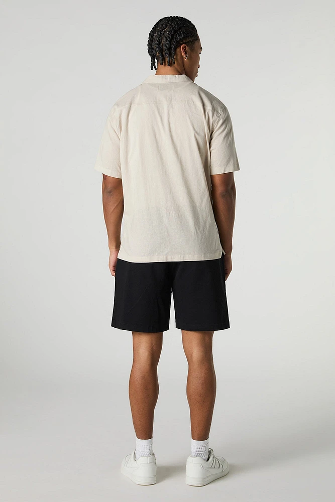 Short mi-long uni à taille coulissante