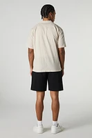 Short mi-long uni à taille coulissante
