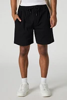 Short mi-long uni à taille coulissante