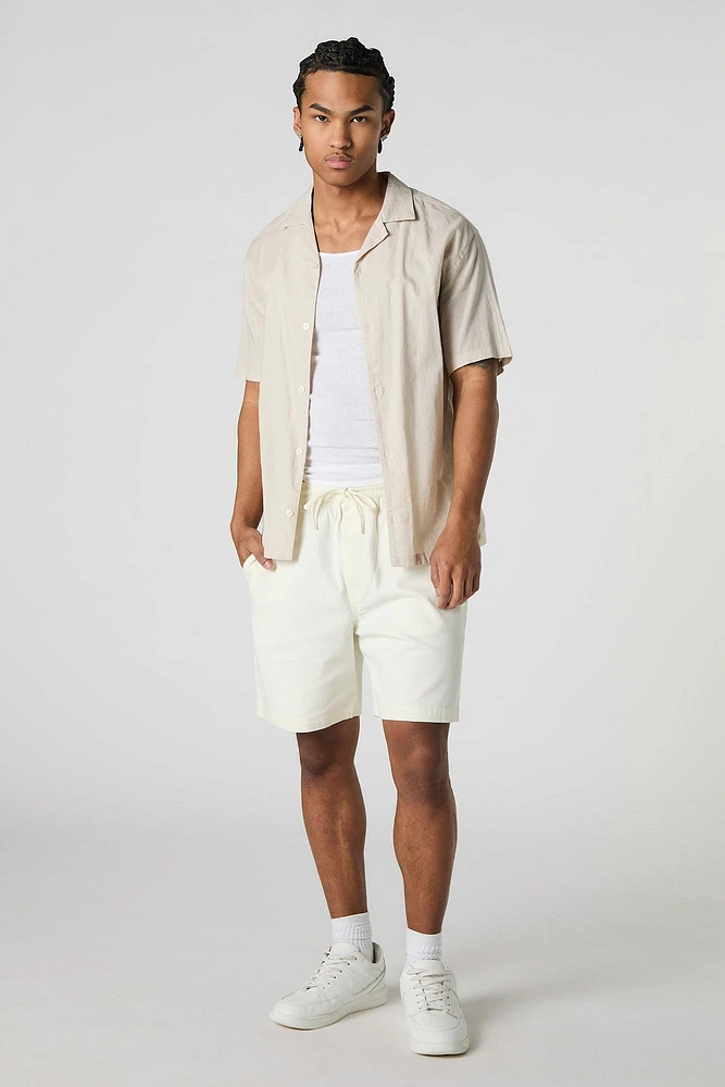 Short mi-long uni à taille coulissante