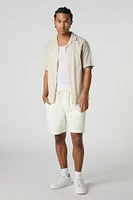 Short mi-long uni à taille coulissante