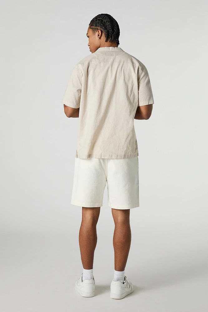 Short mi-long uni à taille coulissante