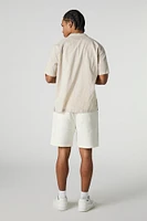 Short mi-long uni à taille coulissante