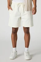 Short mi-long uni à taille coulissante