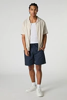 Short mi-long uni à taille coulissante
