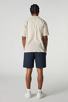 Short mi-long uni à taille coulissante