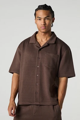 Polo boutonné texturé