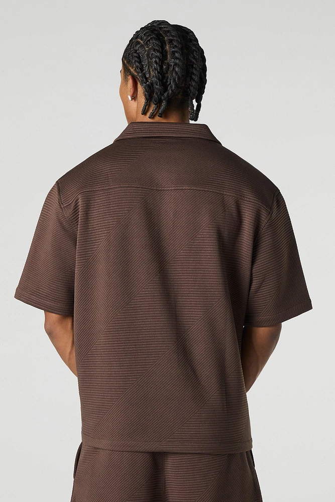 Polo boutonné texturé