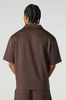 Polo boutonné texturé
