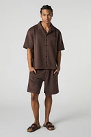 Polo boutonné texturé