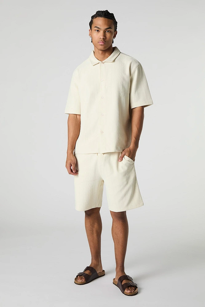Haut carré boutonné texturé avec motif géométrique