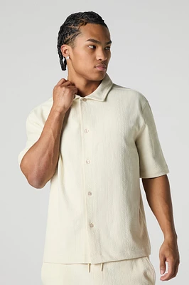 Haut carré boutonné texturé avec motif géométrique