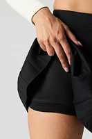 Minijupe-short plissée unie
