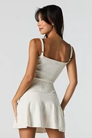 Minirobe-chandail en tricot torsadé avec encolure V