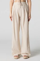 Pantalon à jambe large en mélange de lin plissé