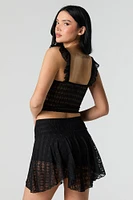 Minijupe-short asymétrique en dentelle