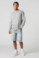 Short en denim d'aspect usé avec franges