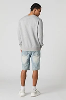 Short en denim d'aspect usé avec franges