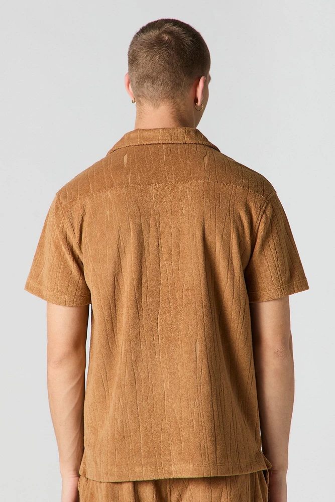 Haut boutonné en tissu éponge texturé